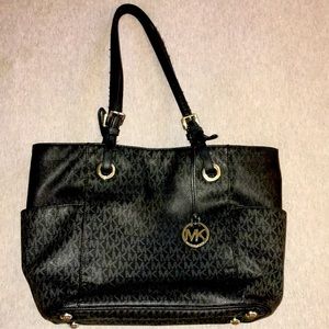 Black Michael Kors purse used in fairly good condition has signs of normal use